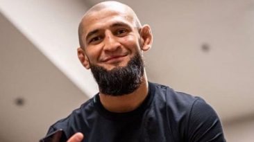 Khamzat Chimaev reacts after reportedly push kicking Kevin Holland in the chest backstage at UFC 279 press conference