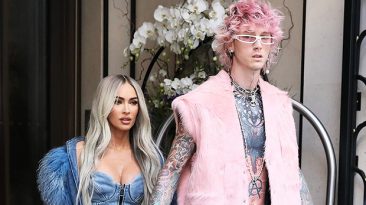 Megan Fox Rocks Plunging Denim Dress & Matching Boots While Holding Hands With MGK In Paris