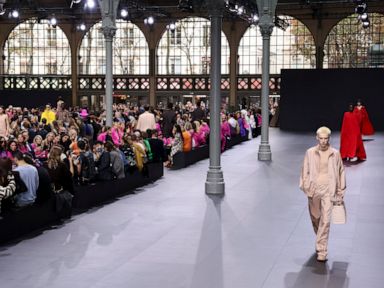 Glitzy Valentino show sees Paris Fashion Week at fever pitch