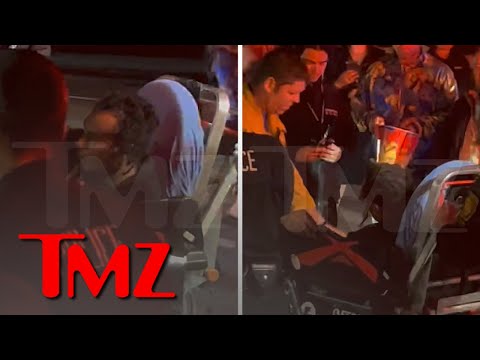 Dave Chappelle Attacker is Stretchered into Ambulance | TMZ