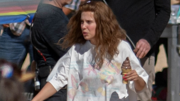 Millie Bobby Brown Rocks T-Shirt Coverup While Filming New Movie On The Beach: Photo