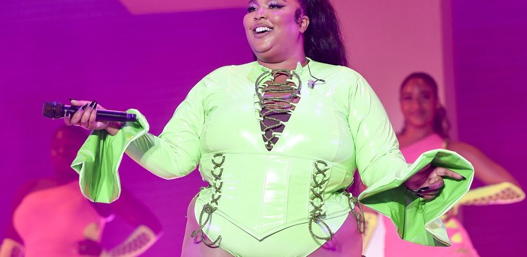 Lizzo Is ‘100% That Grinch’ in Festive Bondage Outfit