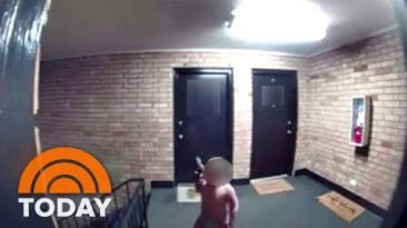 Toddler seen waving gun at apartment complex in security video