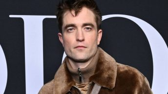 Robert Pattinson Wore A Skirt And A Brown Fleece To Paris Fashion Week, And It Sure Is Something