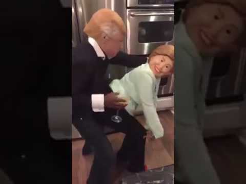 Mediatakeout African American couple dressed up as Donald and Hillary dancing to jamaican music