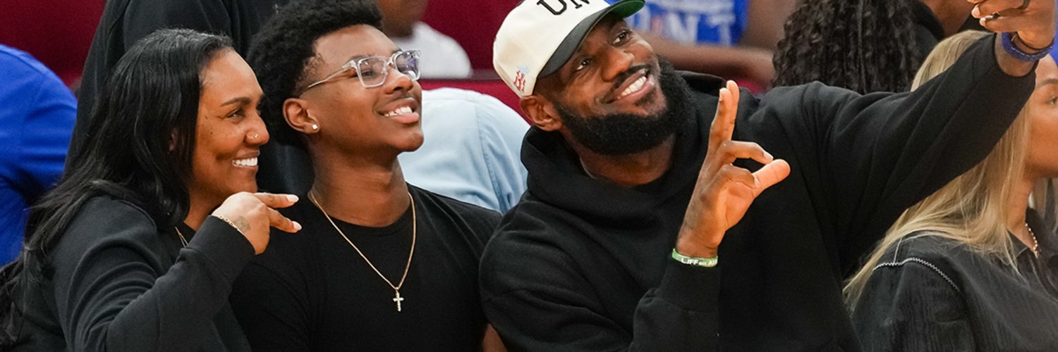 LeBron James Sits Courtside For Bronny’s McDonald’s Game, Fired Up For Son