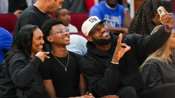 LeBron James Sits Courtside For Bronny’s McDonald’s Game, Fired Up For Son