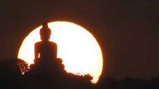 7-April-2023: Sun setting behind the Big Buddha in Phuket Thailand. Camera Nikon CoolPix P900