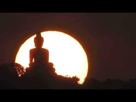 7-April-2023: Sun setting behind the Big Buddha in Phuket Thailand. Camera Nikon CoolPix P900