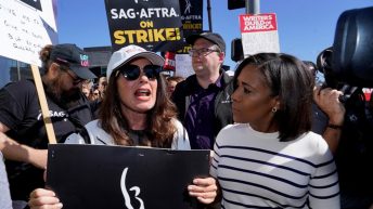 Movie and TV stars join picket lines in fight over the future of Hollywood