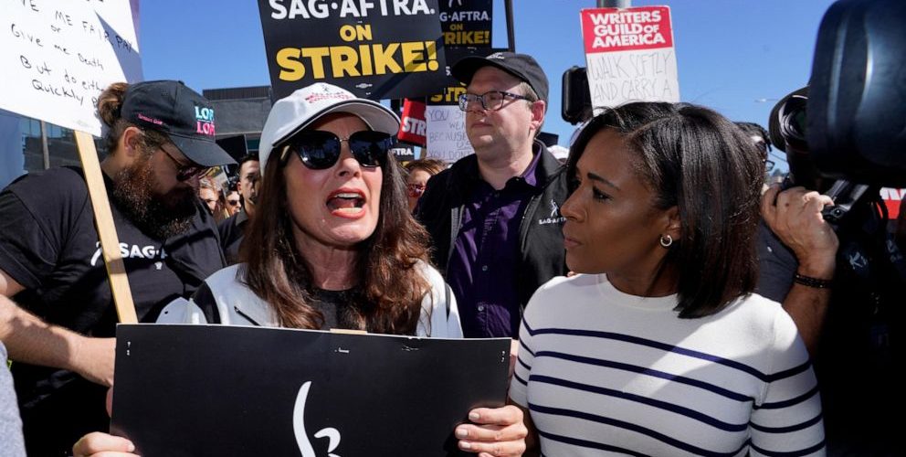 Movie and TV stars join picket lines in fight over the future of Hollywood