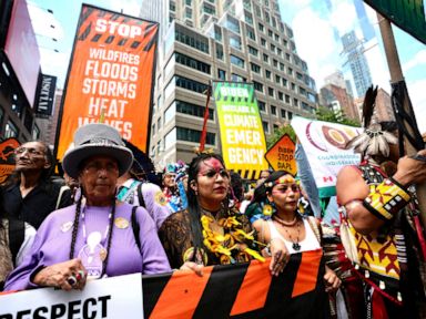 Tens of thousands march to kick off climate summit, demanding end to warming-causing fossil fuels