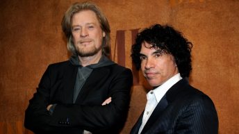 Daryl Hall is suing John Oates over plan to sell stake in joint venture. A judge has paused the sale