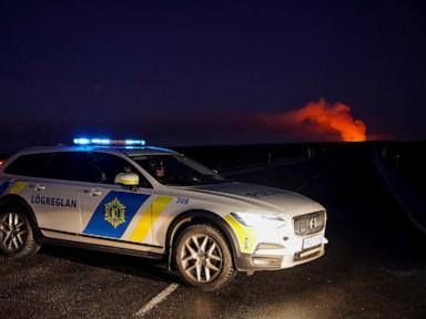 A volcano erupts in southwestern Iceland, sending lava flowing toward a nearby settlement