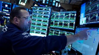 Stock market today: Wall Street hangs near records ahead of inflation report