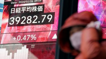 Stock market today: Asian shares mostly decline, while Tokyo again touches a record high