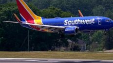 Southwest breaks with 50-year tradition and will assign seats; profit falls at Southwest, American